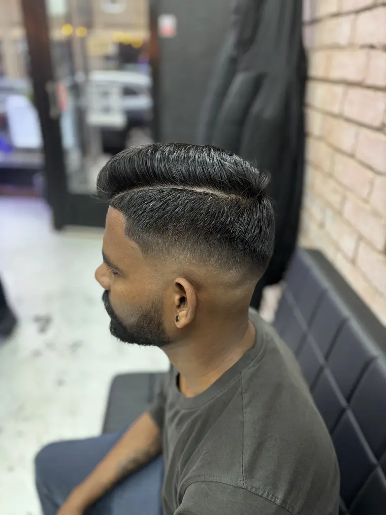 Textured pompadour with a sharp line-up at Galaxy Barber